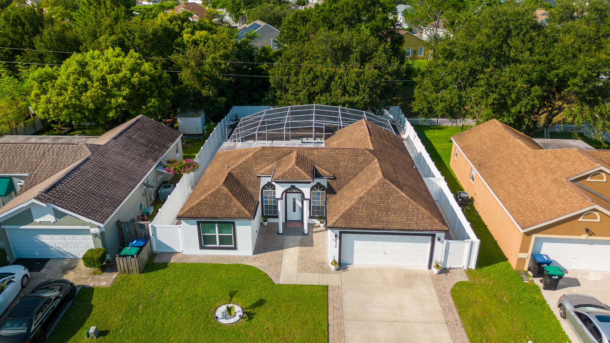 Aerial view of a Florida home with a screened pool