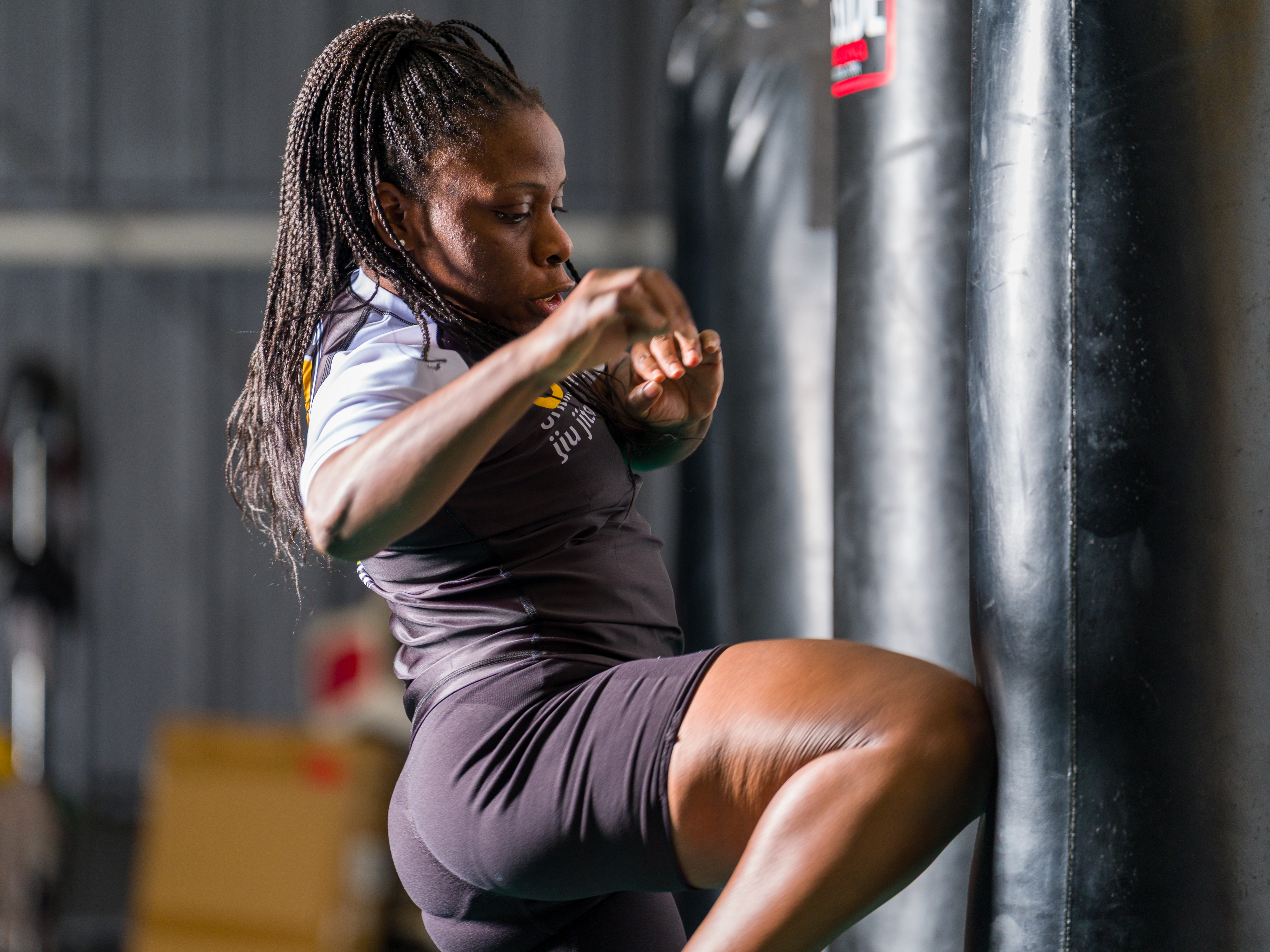 Athlete striking a heavy bag in training