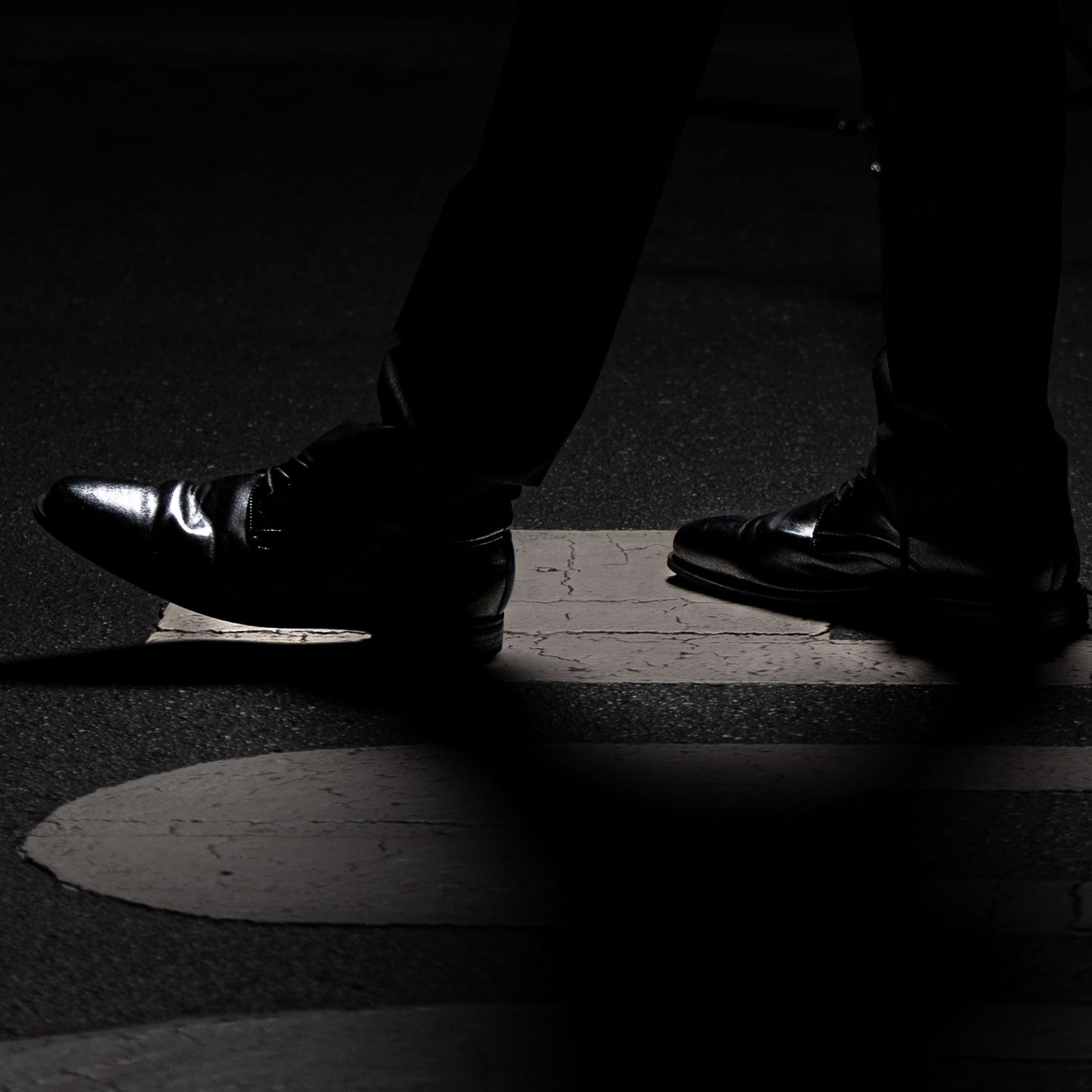 Subject walking under a streetlight